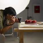 medium-shot-photographer-taking-fruit-photos