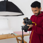 medium-shot-specialized-photographer-working-studio